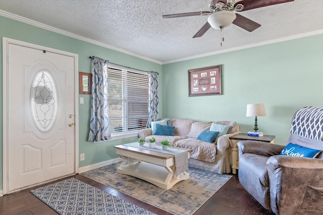 living room featuring crown molding, ceiling fan, dark hardwood / wood-style flooring, and a textured ceiling