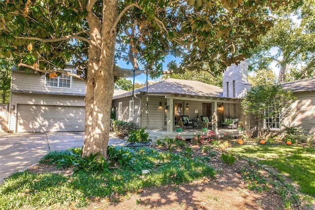 view of front facade featuring a garage and covered porch