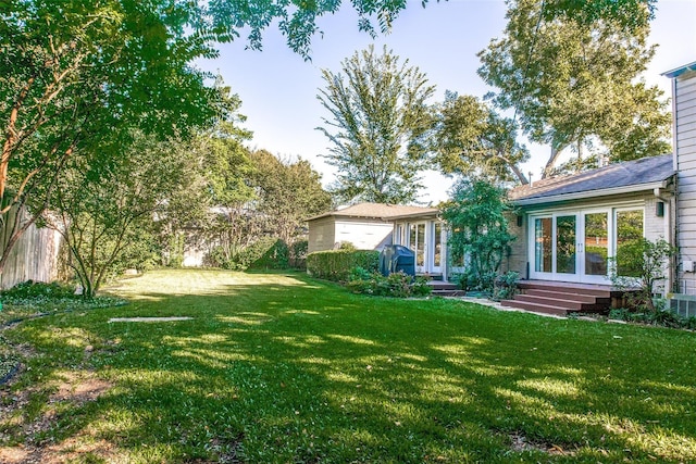 view of yard with french doors