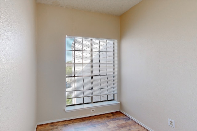 empty room featuring hardwood / wood-style floors