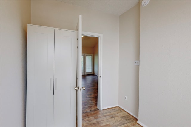 unfurnished bedroom featuring light hardwood / wood-style floors and a closet