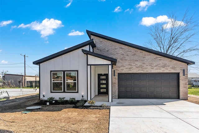 modern home with brick siding, board and batten siding, concrete driveway, and an attached garage