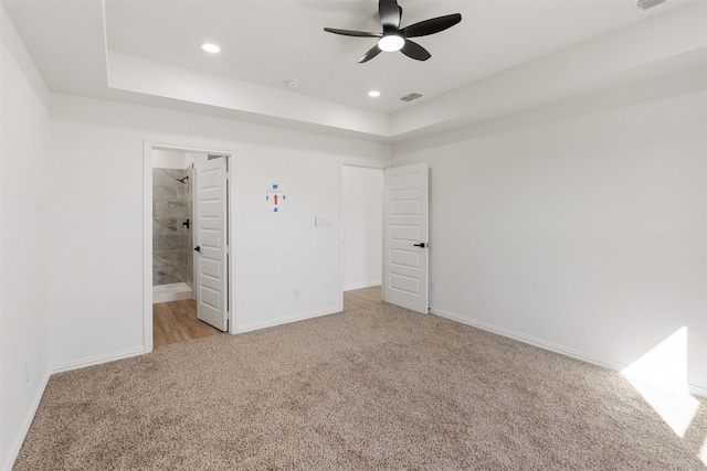unfurnished bedroom with visible vents, recessed lighting, light colored carpet, and baseboards