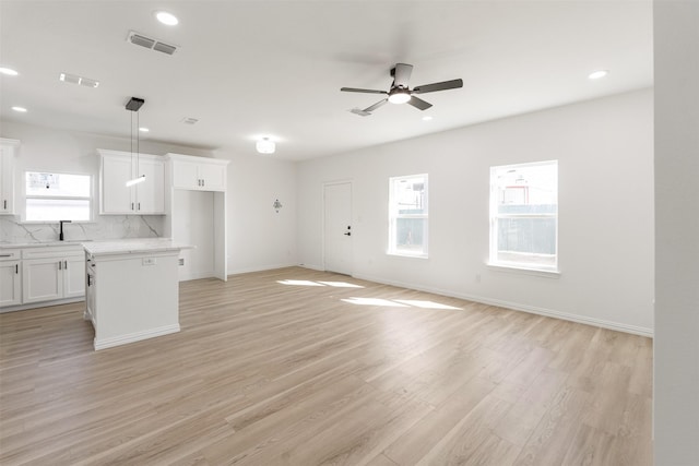 unfurnished living room featuring recessed lighting, visible vents, light wood-style floors, and ceiling fan