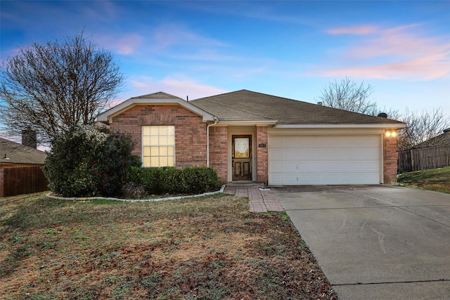 ranch-style home featuring a garage