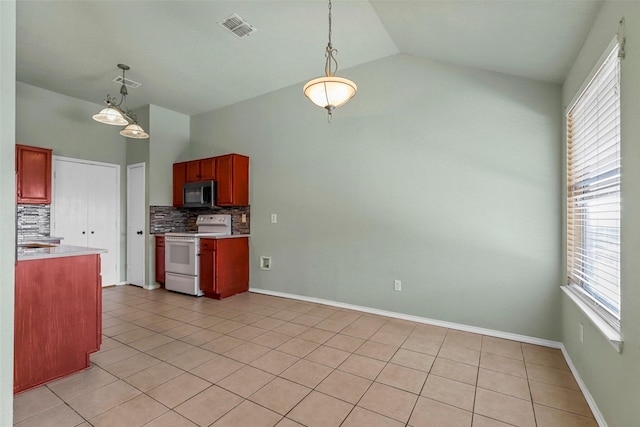 kitchen with vaulted ceiling, light tile patterned flooring, pendant lighting, white electric range, and tasteful backsplash