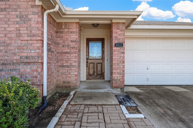 doorway to property featuring a garage