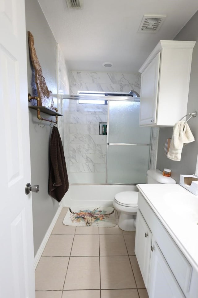 11243 Country Ridge Ln, Forney, TX 75126 - bathroom with shower / bath combination with glass door, tile patterned flooring, visible vents, toilet, and vanity