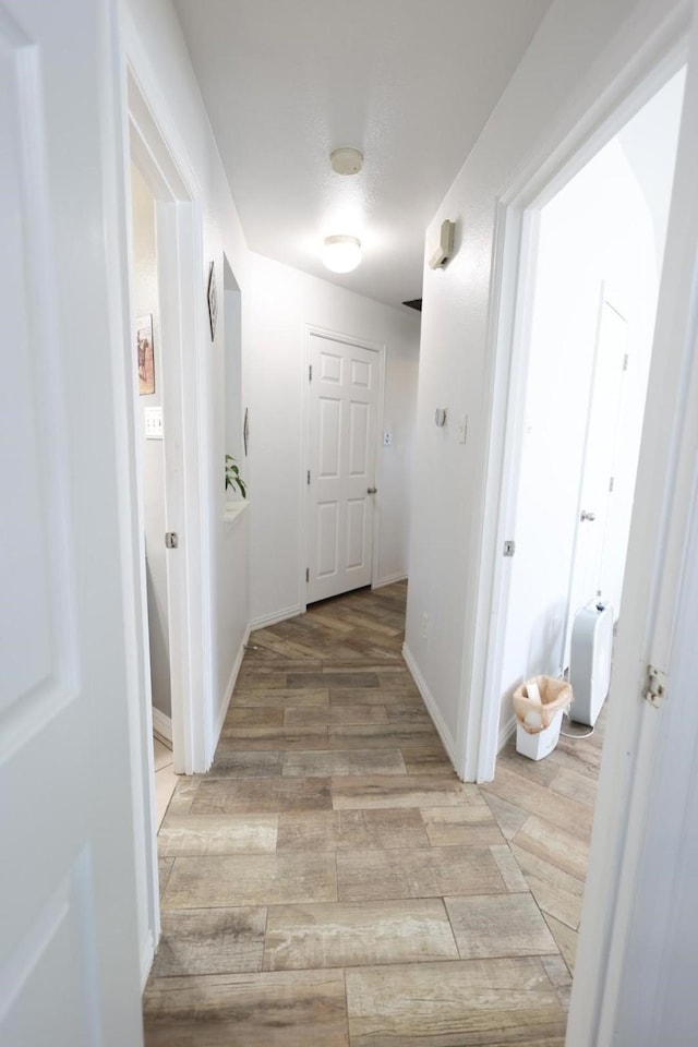 11243 Country Ridge Ln, Forney, TX 75126 - hallway featuring baseboards and light wood finished floors