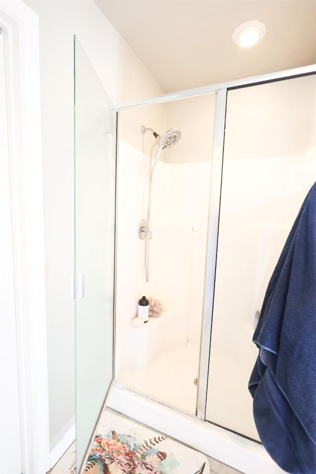 full bathroom featuring a shower stall