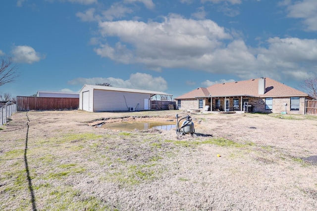 11243 Country Ridge Ln, Forney, TX 75126 - back of property featuring an outdoor structure and fence