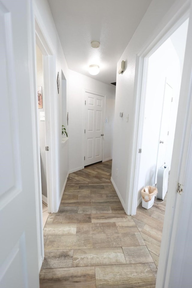 corridor featuring light hardwood / wood-style flooring