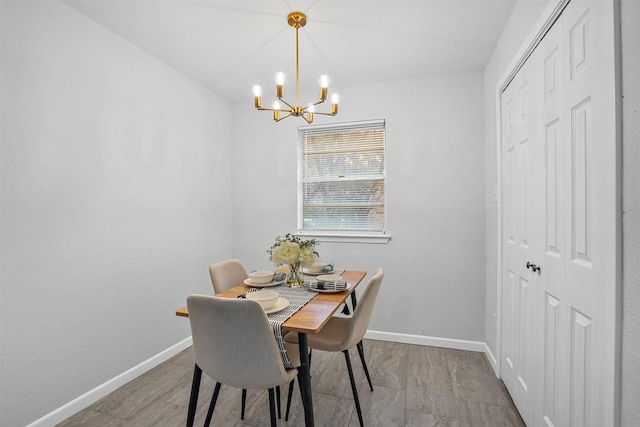 dining room featuring a notable chandelier and light hardwood / wood-style floors