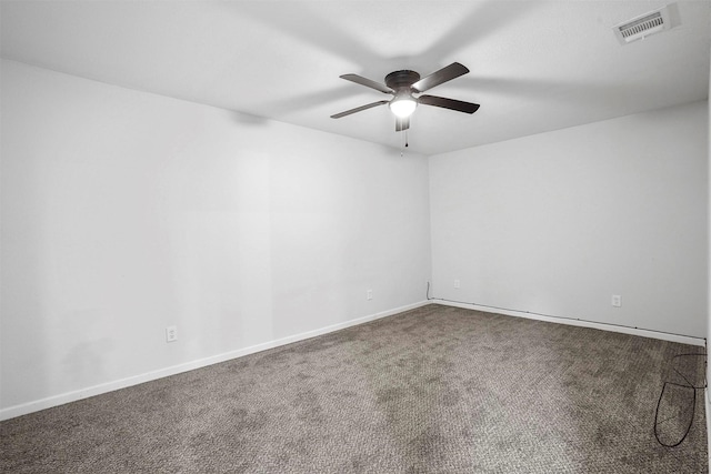 empty room featuring ceiling fan and carpet flooring