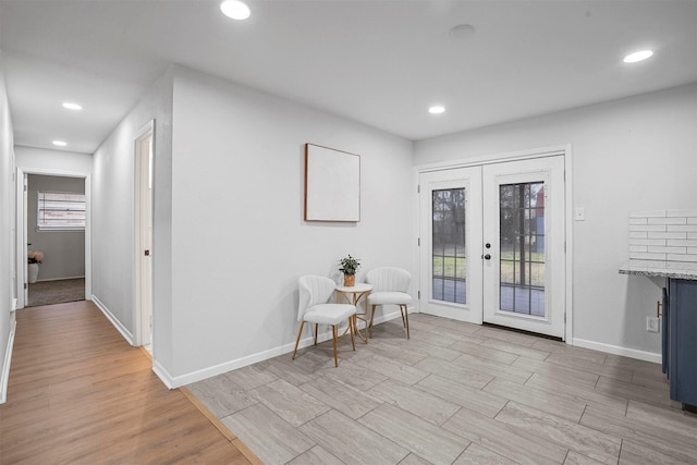 interior space featuring french doors and light wood-type flooring