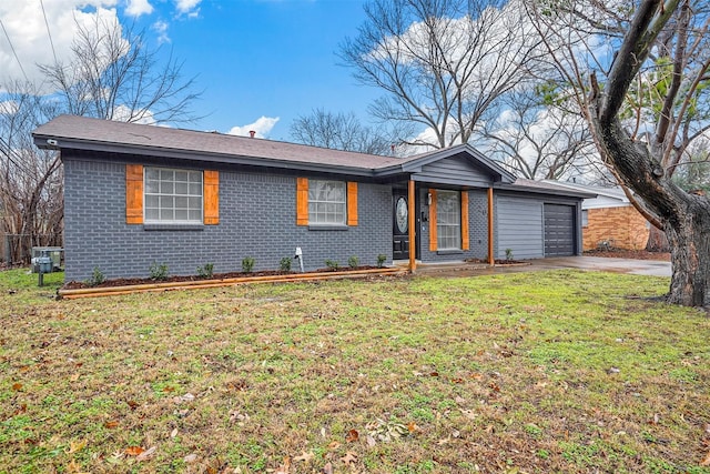 ranch-style house featuring a garage and a front lawn