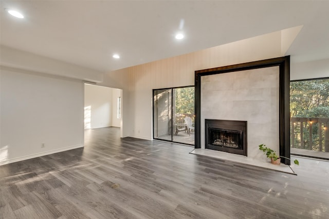 unfurnished living room with plenty of natural light and wood-type flooring