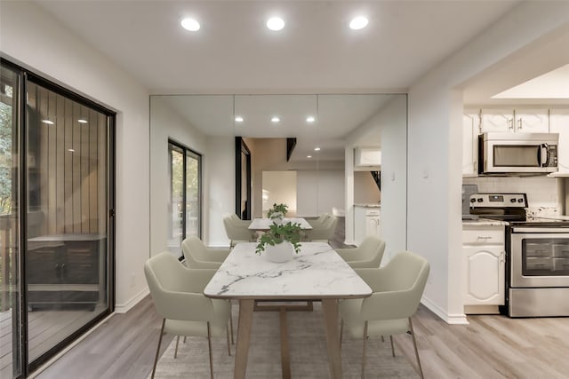 dining area with light wood-type flooring