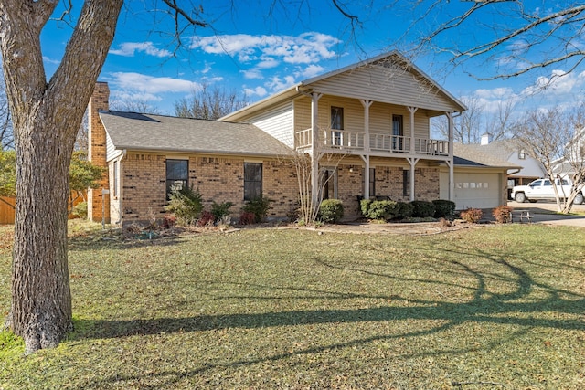 front of property with a balcony, a garage, and a front yard