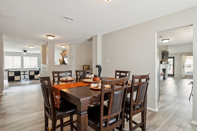 dining space featuring light hardwood / wood-style floors