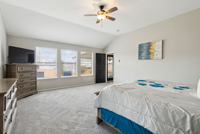 carpeted bedroom with vaulted ceiling and ceiling fan