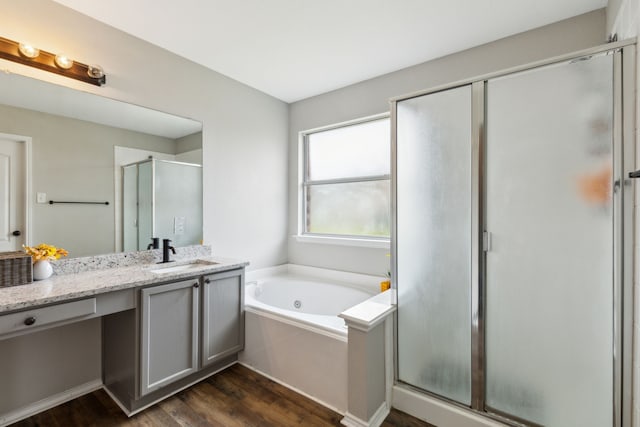 bathroom featuring vanity, shower with separate bathtub, and wood-type flooring