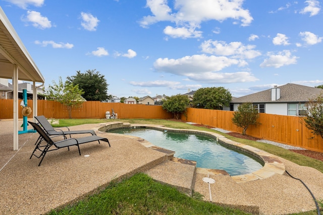 view of swimming pool with a patio