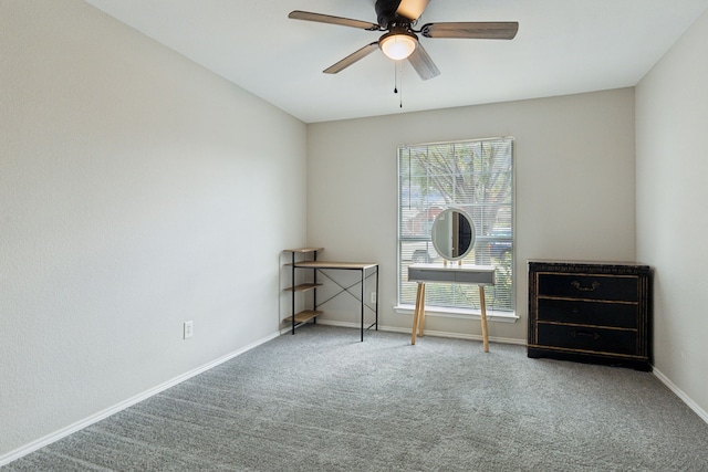 spare room with carpet flooring and ceiling fan