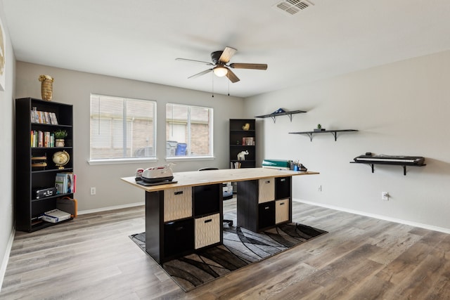 office space featuring hardwood / wood-style floors and ceiling fan