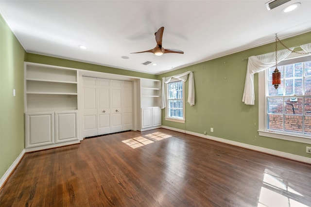 unfurnished bedroom with hardwood / wood-style floors, a closet, and ceiling fan