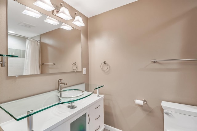 bathroom with vanity and toilet