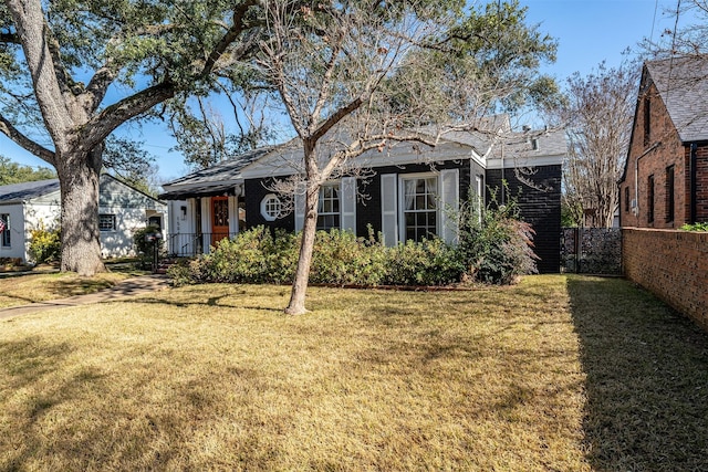 rear view of house with a lawn