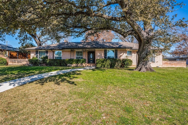 ranch-style house with a front yard