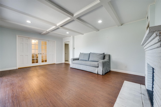 living room featuring french doors, coffered ceiling, dark hardwood / wood-style floors, beamed ceiling, and a fireplace