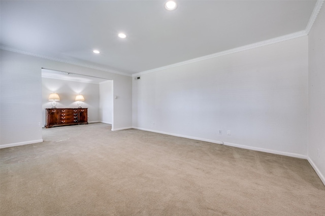 carpeted empty room featuring ornamental molding