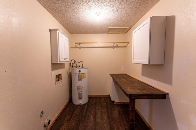 laundry area featuring cabinets, a textured ceiling, dark hardwood / wood-style floors, washer hookup, and water heater