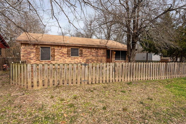 view of side of home featuring a yard