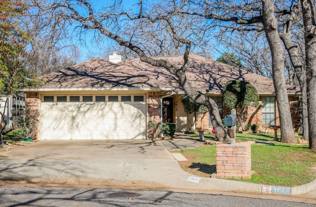 ranch-style house featuring a garage