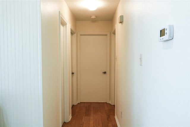 corridor featuring wood-type flooring