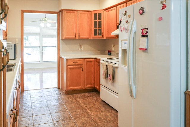 kitchen with ceiling fan, wall chimney range hood, and white appliances