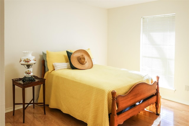 bedroom with hardwood / wood-style flooring