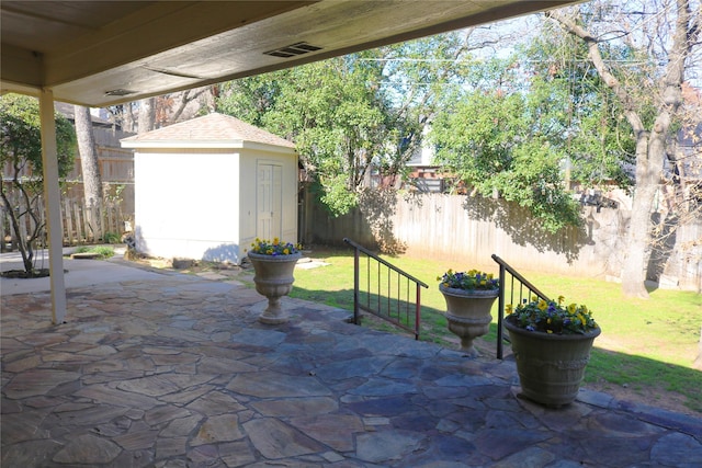 view of patio with a storage shed