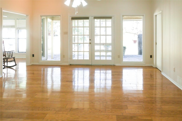 entryway featuring light hardwood / wood-style floors and french doors