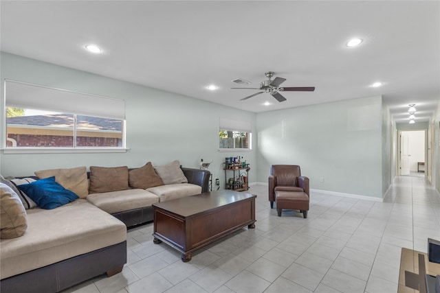 living room featuring ceiling fan and light tile patterned floors