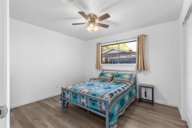 bedroom featuring ceiling fan and hardwood / wood-style floors