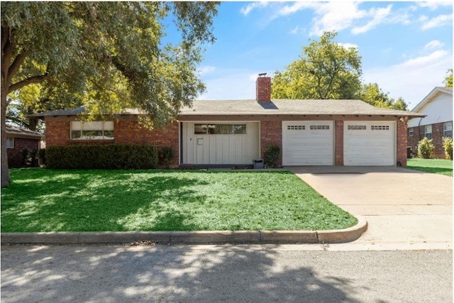 ranch-style house with a garage and a front yard