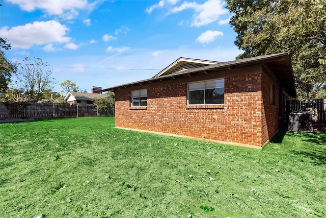 view of property exterior with a yard and cooling unit