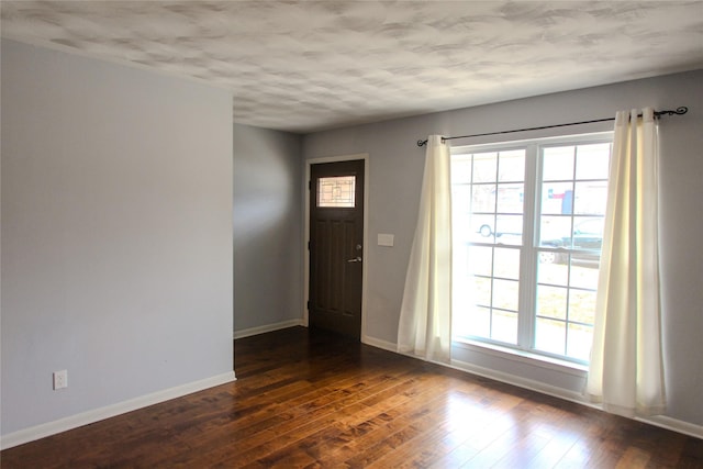 entryway with dark hardwood / wood-style floors