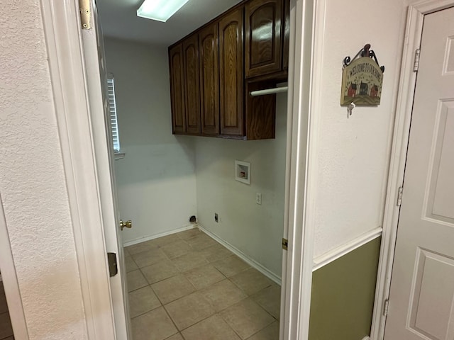 laundry room featuring hookup for a washing machine, electric dryer hookup, and cabinets