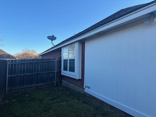 view of home's exterior with fence